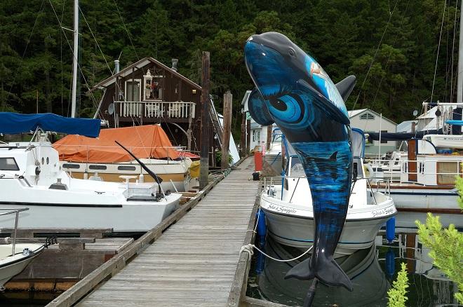 Artwork adorns docks and boathouses throughout the marina. © Deane Hislop
